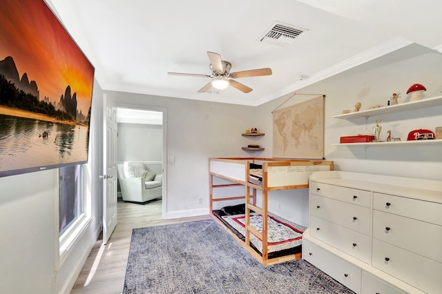 850 Green St, West Palm Beach, FL 33405 - bedroom featuring crown molding, baseboards, visible vents, and light wood-style floors
