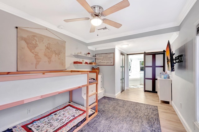850 Green St, West Palm Beach, FL 33405 - bedroom with visible vents, a barn door, baseboards, light wood-style floors, and ornamental molding