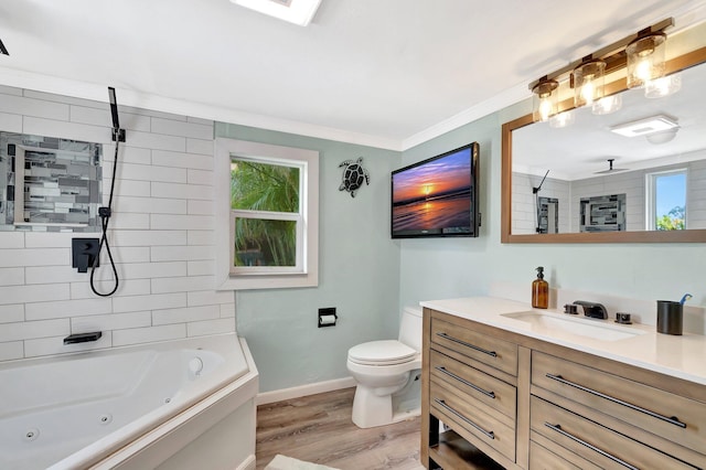 850 Green St, West Palm Beach, FL 33405 - full bathroom with vanity, crown molding, wood finished floors, toilet, and baseboards