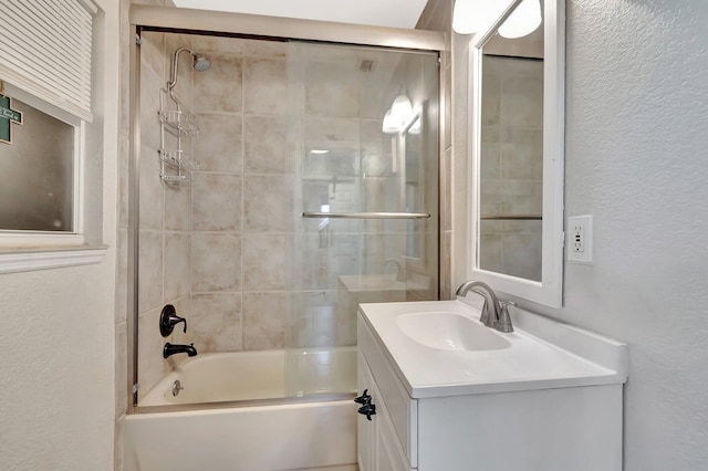 850 Green St, West Palm Beach, FL 33405 - bathroom with vanity, a textured wall, and shower / bath combination