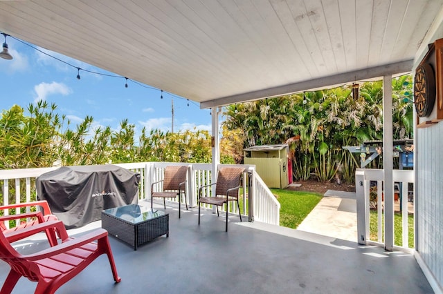850 Green St, West Palm Beach, FL 33405 - view of patio / terrace with grilling area, an outdoor structure, and a shed