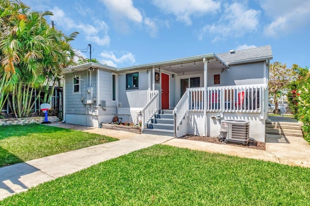850 Green St, West Palm Beach, FL 33405 - view of front of property featuring central air condition unit and a front yard