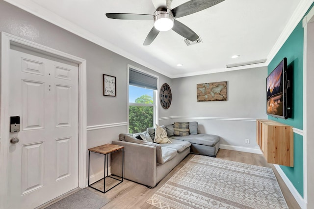 850 Green St, West Palm Beach, FL 33405 - living area featuring baseboards, visible vents, ornamental molding, and light wood finished floors