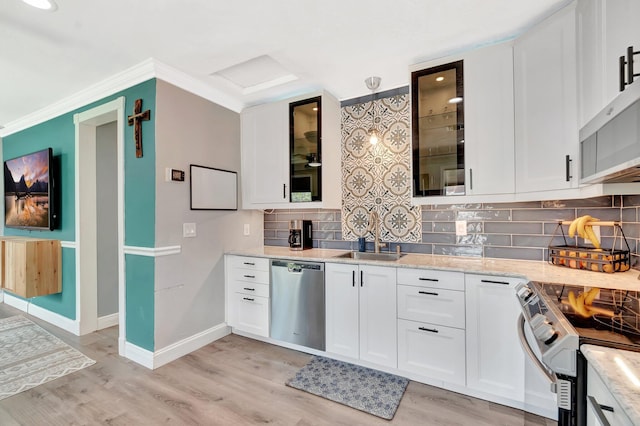 850 Green St, West Palm Beach, FL 33405 - kitchen featuring a sink, light stone countertops, stainless steel appliances, and white cabinetry