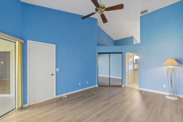 5942 Parkwalk Cir W, Boynton Beach, FL 33472 - unfurnished bedroom featuring wood finished floors, visible vents, high vaulted ceiling, and two closets