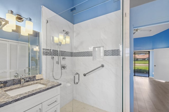 5942 Parkwalk Cir W, Boynton Beach, FL 33472 - bathroom with a shower stall, a ceiling fan, and vanity