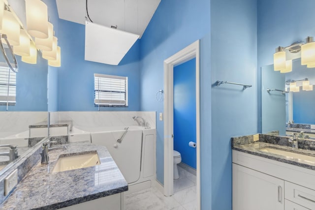 5942 Parkwalk Cir W, Boynton Beach, FL 33472 - full bath featuring two vanities, marble finish floor, a sink, and toilet