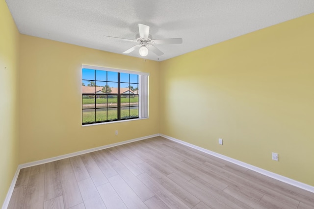5942 Parkwalk Cir W, Boynton Beach, FL 33472 - unfurnished room with light wood finished floors, a ceiling fan, and baseboards