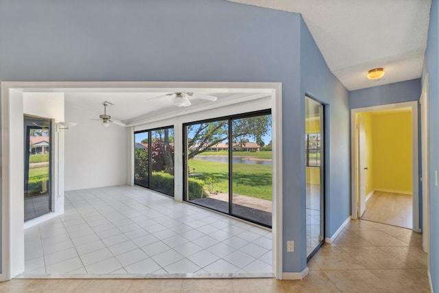 5942 Parkwalk Cir W, Boynton Beach, FL 33472 - spare room featuring a water view, tile patterned flooring, a ceiling fan, baseboards, and a smoke detector