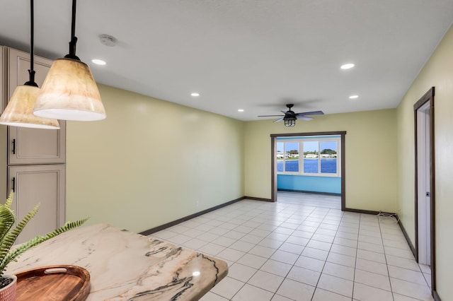 1116 Lake Ter Unit 203, Boynton Beach, FL 33426 - unfurnished dining area featuring baseboards, recessed lighting, a ceiling fan, light tile patterned floors, and a water view