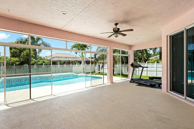 view of pool with a patio, a fenced backyard, and a ceiling fan