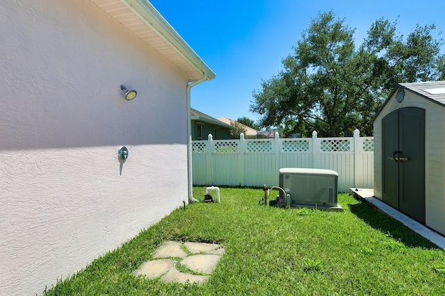 view of yard featuring a storage unit and an outbuilding