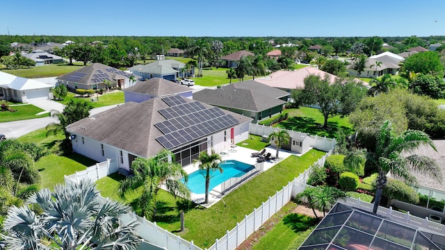 aerial perspective of suburban area featuring a pool area
