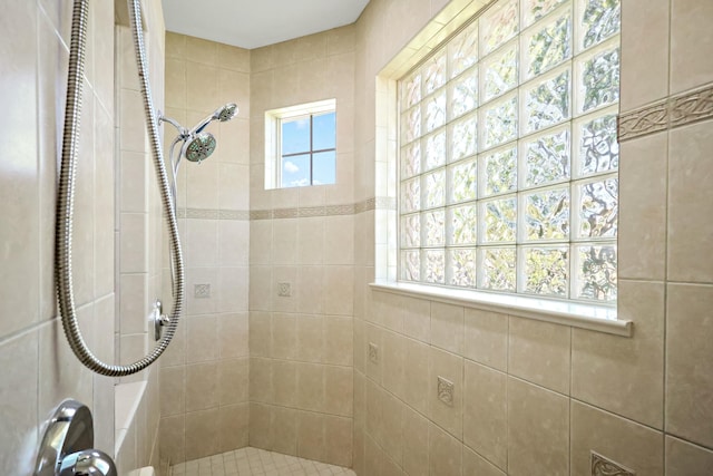 bathroom with tiled shower