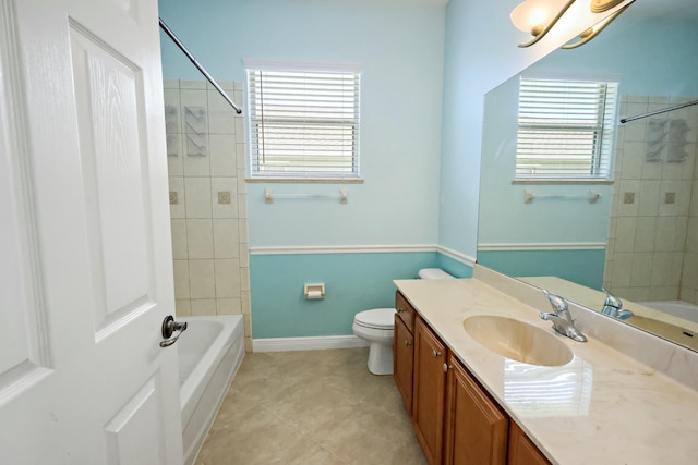 bathroom featuring vanity, toilet, bathtub / shower combination, and tile patterned floors