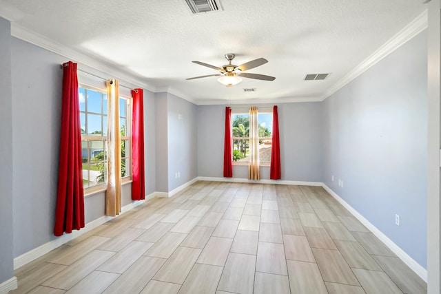 unfurnished room with a ceiling fan, baseboards, crown molding, a textured ceiling, and wood tiled floors