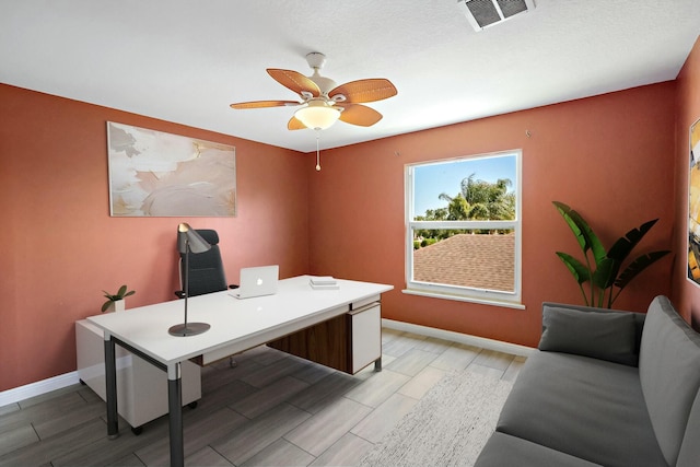 office space with ceiling fan, baseboards, and wood finish floors