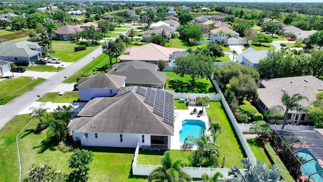 aerial view of residential area featuring a pool