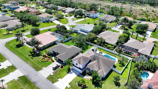 aerial view of residential area with a pool