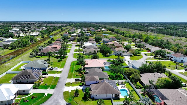 aerial view of residential area with a pool