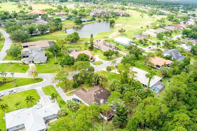 aerial view featuring view of golf course, a water view, and a residential view