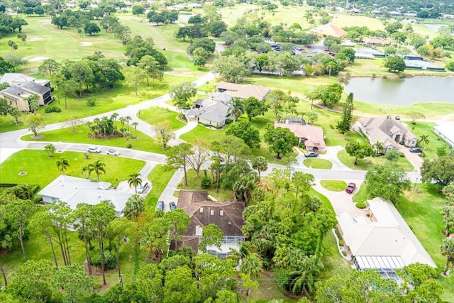 aerial view featuring golf course view, a water view, and a residential view