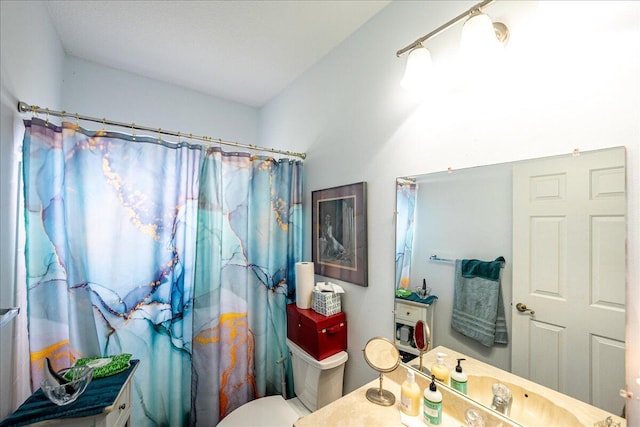 full bathroom with toilet, vanity, and a shower with curtain