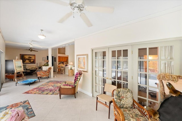 living room with light tile patterned floors, french doors, baseboards, and a ceiling fan