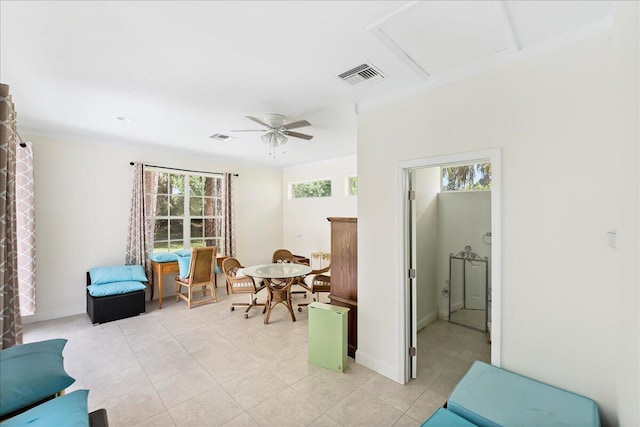 sitting room featuring attic access, ceiling fan, baseboards, and visible vents