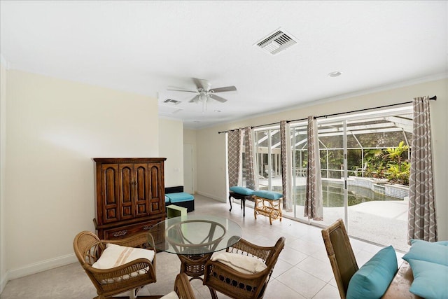 sitting room featuring ornamental molding, baseboards, a ceiling fan, and visible vents