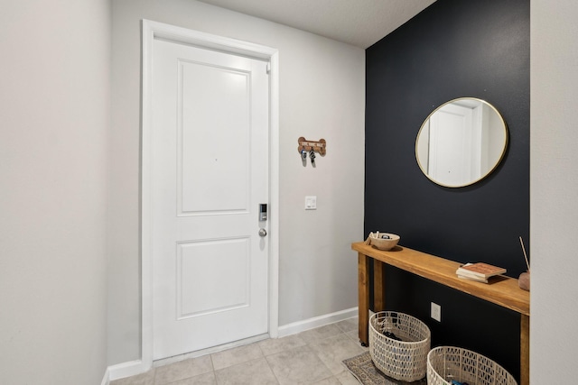 5684 Mentmore Dr, Mangonia Park, FL 33407 - foyer with baseboards and light tile patterned flooring