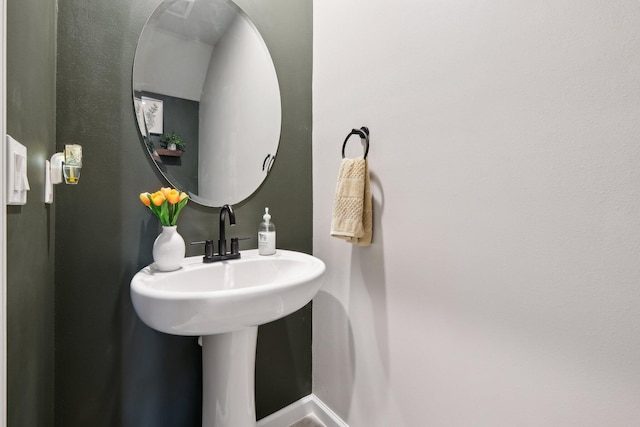 5684 Mentmore Dr, Mangonia Park, FL 33407 - bathroom featuring baseboards