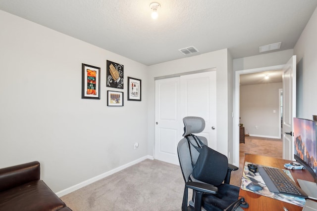 5684 Mentmore Dr, Mangonia Park, FL 33407 - office space featuring a textured ceiling, carpet flooring, baseboards, and visible vents