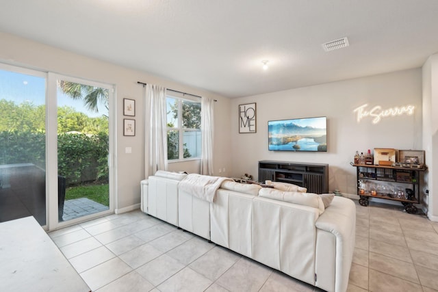 5684 Mentmore Dr, Mangonia Park, FL 33407 - living room featuring visible vents, baseboards, and light tile patterned flooring