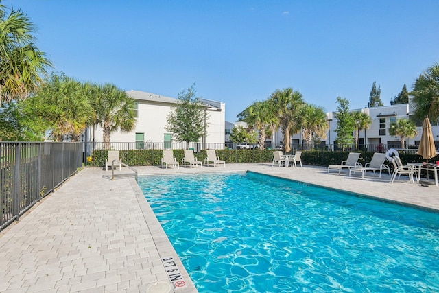 5684 Mentmore Dr, Mangonia Park, FL 33407 - pool with a patio area and fence