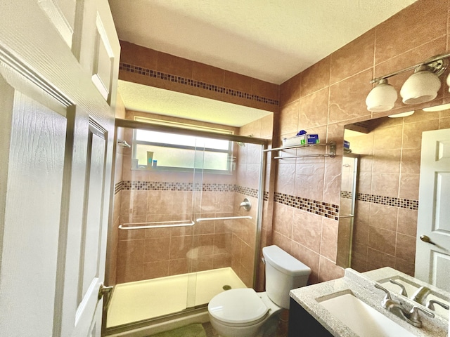 215 Monterey Way, Royal Palm Beach, FL 33411 - full bathroom featuring tile walls, a stall shower, vanity, and toilet