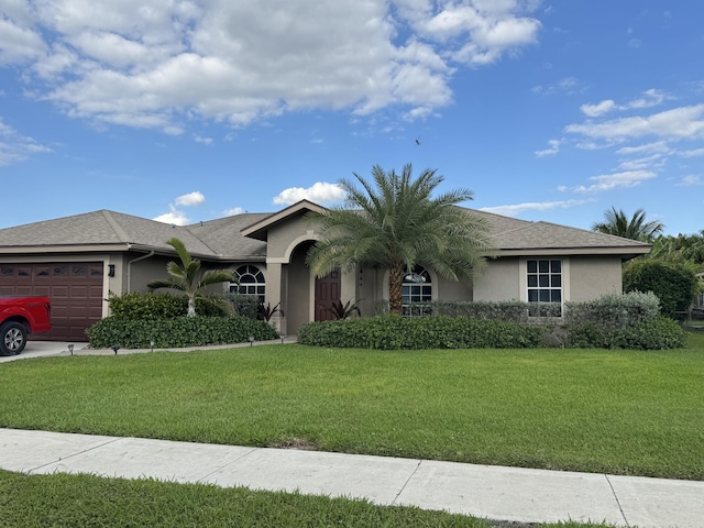 215 Monterey Way, Royal Palm Beach, FL 33411 - single story home with an attached garage, stucco siding, and a front lawn