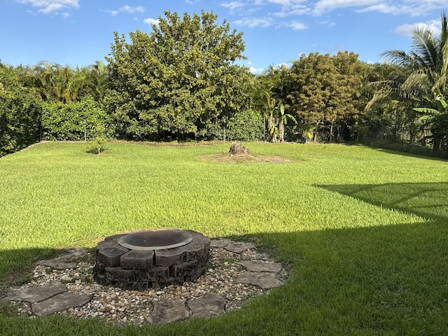 215 Monterey Way, Royal Palm Beach, FL 33411 - view of grassy yard featuring a fire pit
