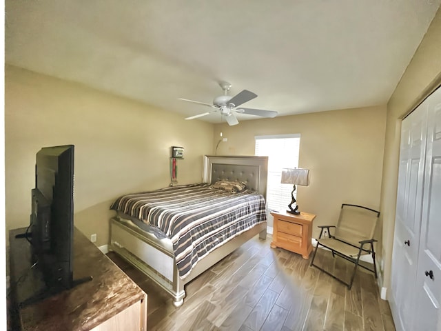 215 Monterey Way, Royal Palm Beach, FL 33411 - bedroom with a closet, wood finished floors, baseboards, and a ceiling fan