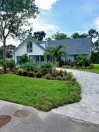 795 SW All American Blvd, Palm City, FL 34990 - view of front of property with a front yard