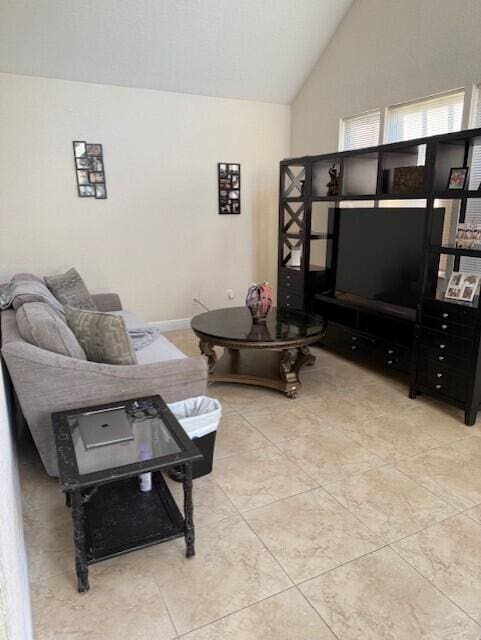 795 SW All American Blvd, Palm City, FL 34990 - living room with high vaulted ceiling and light tile patterned floors