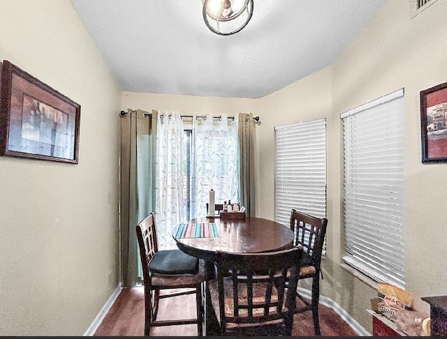 3696 Timberline Dr, West Palm Beach, FL 33406 - dining area featuring baseboards and dark wood-style floors