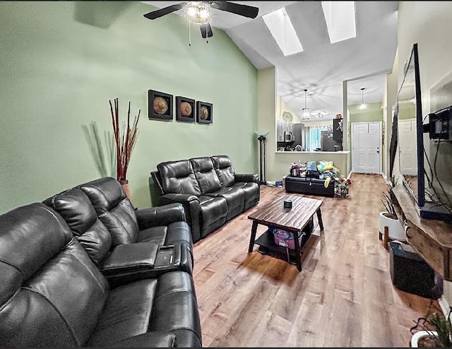 3696 Timberline Dr, West Palm Beach, FL 33406 - living area with lofted ceiling with skylight, wood finished floors, and ceiling fan