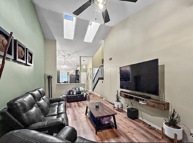 3696 Timberline Dr, West Palm Beach, FL 33406 - living area featuring high vaulted ceiling, ceiling fan, wood finished floors, and a skylight