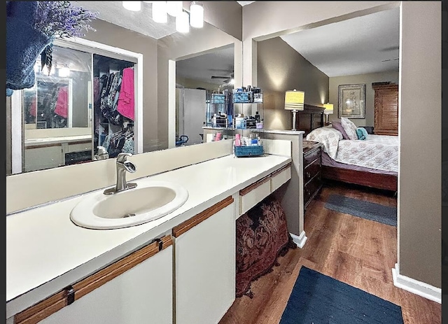 3696 Timberline Dr, West Palm Beach, FL 33406 - bathroom featuring ensuite bathroom, vanity, and wood finished floors