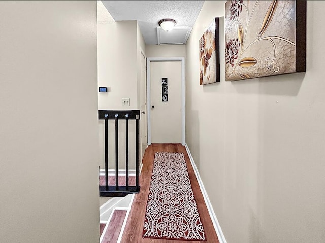 3696 Timberline Dr, West Palm Beach, FL 33406 - hallway featuring a textured ceiling and wood finished floors
