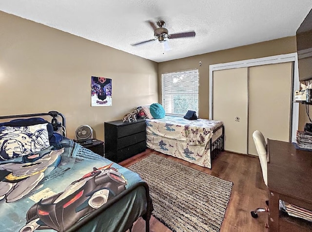 3696 Timberline Dr, West Palm Beach, FL 33406 - bedroom featuring ceiling fan, a closet, a textured ceiling, and wood finished floors