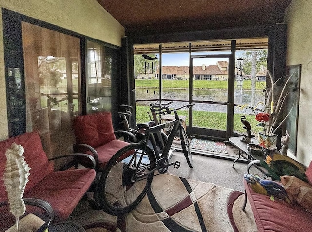 3696 Timberline Dr, West Palm Beach, FL 33406 - sunroom / solarium featuring a water view and carpet