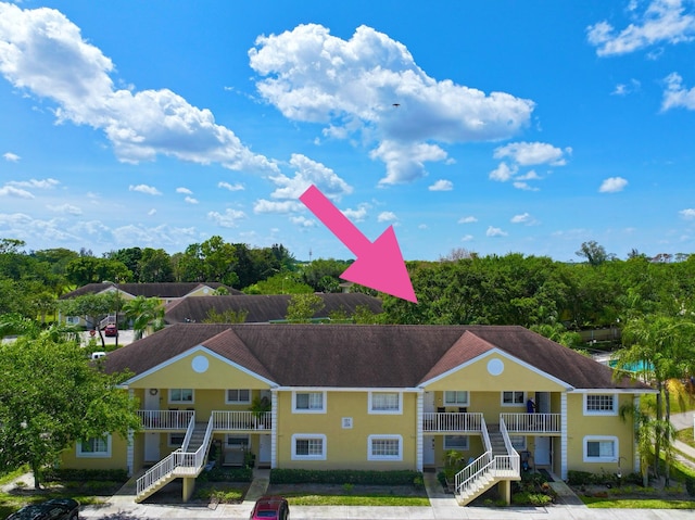 208 Palm Beach Trace Dr, Royal Palm Beach, FL 33411 - view of building exterior with stairway