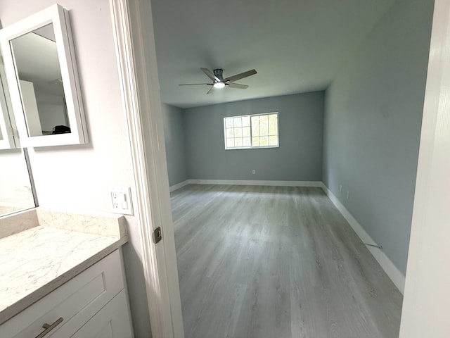 208 Palm Beach Trace Dr, Royal Palm Beach, FL 33411 - unfurnished room featuring a ceiling fan, light wood-style flooring, and baseboards